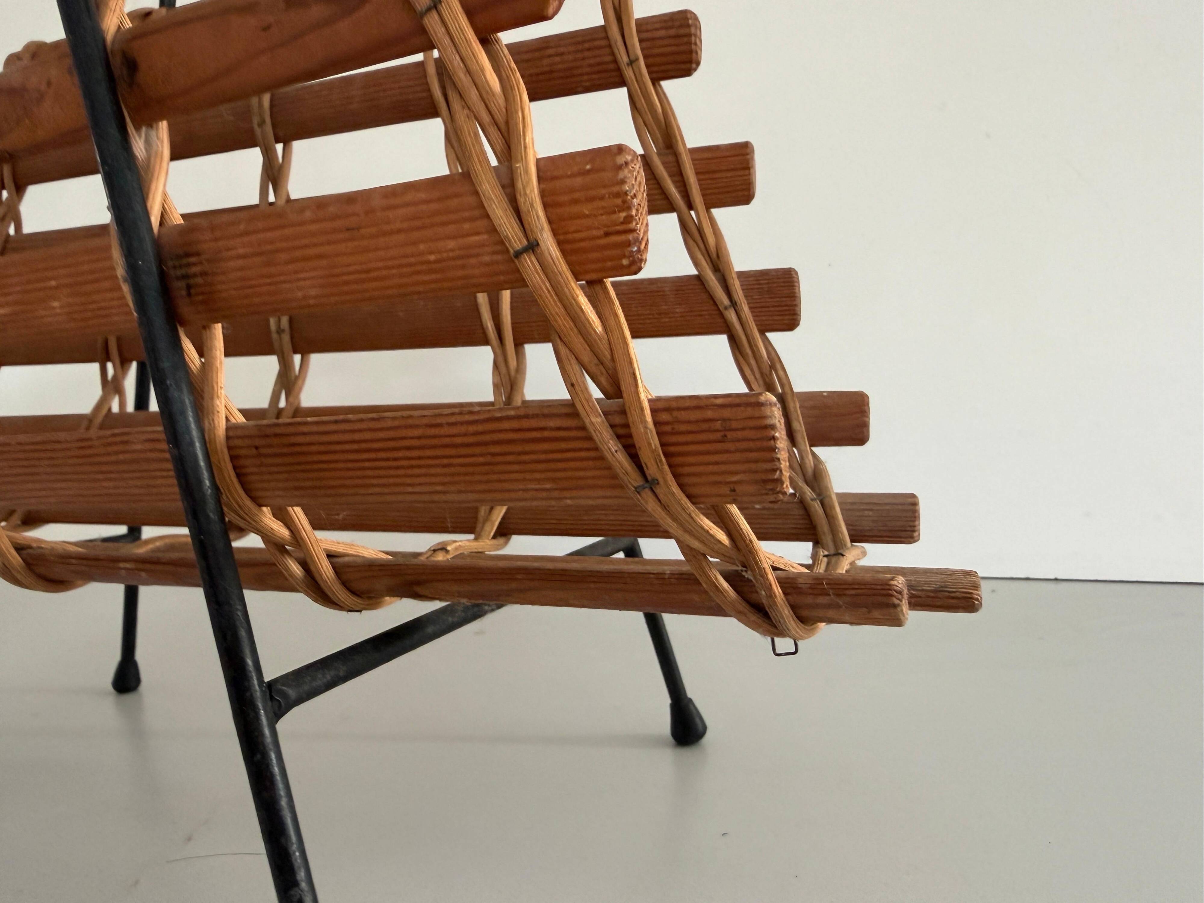 Mid-century black metal and wicker magazine rack, 1960, Germany