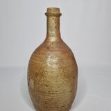 Set of three enamelled terracotta bottles