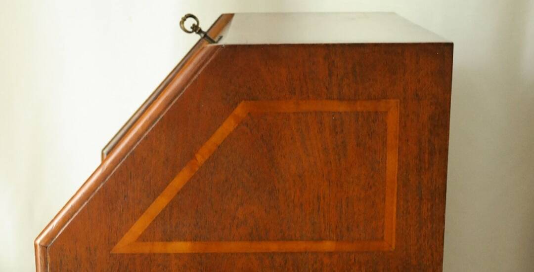 Sloped walnut secretary from the 20th century.