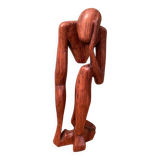 Wooden sculpture inspired by Rodin's "The Thinker"