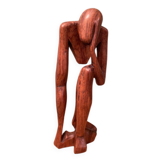 Wooden sculpture inspired by Rodin's "The Thinker"