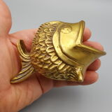 Old brass ashtray in the shape of a fish