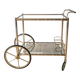 Serving table in gilded metal and glass with large wheels 1950