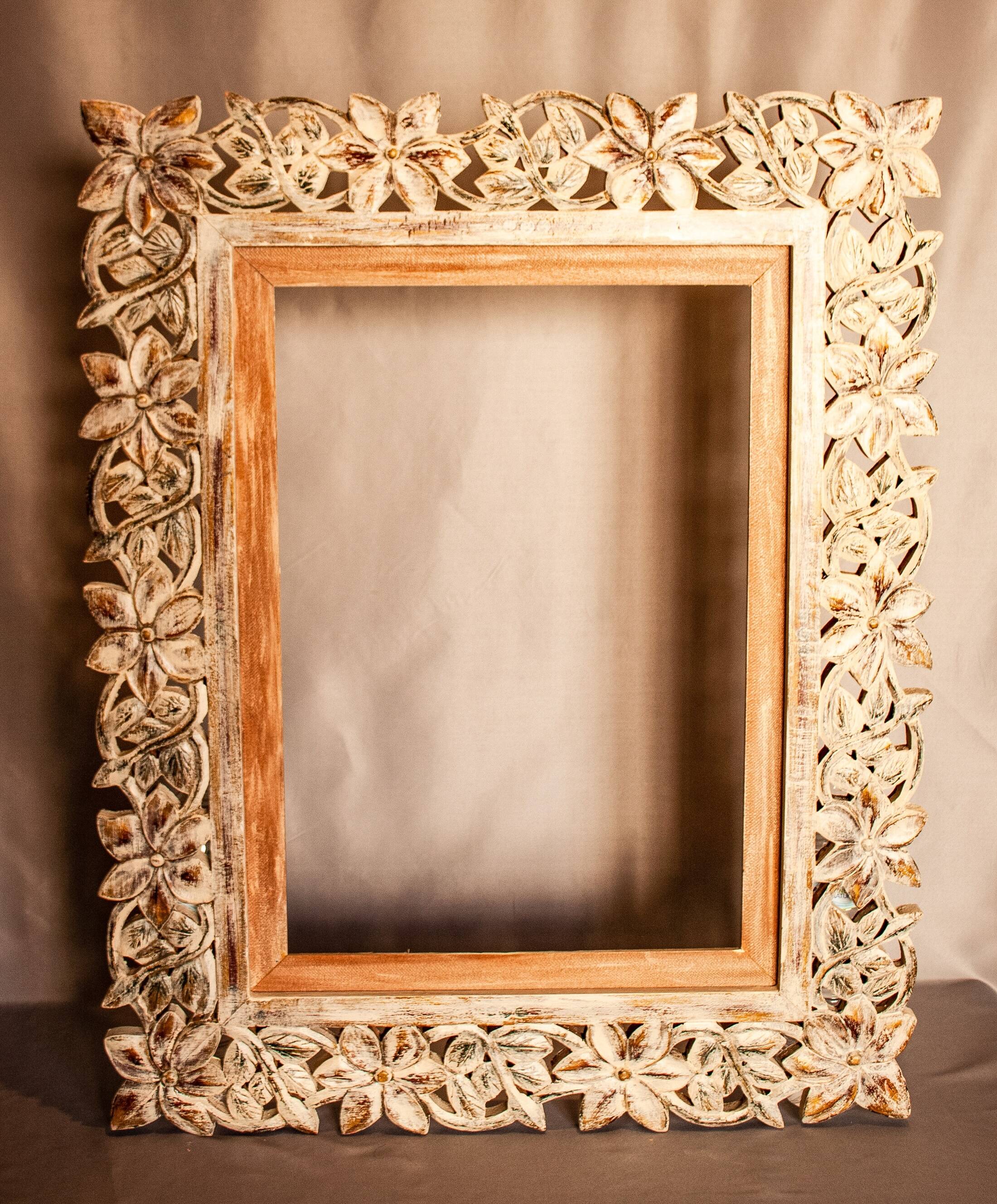 Carved wooden frame. carved wooden frame with floral motifs.