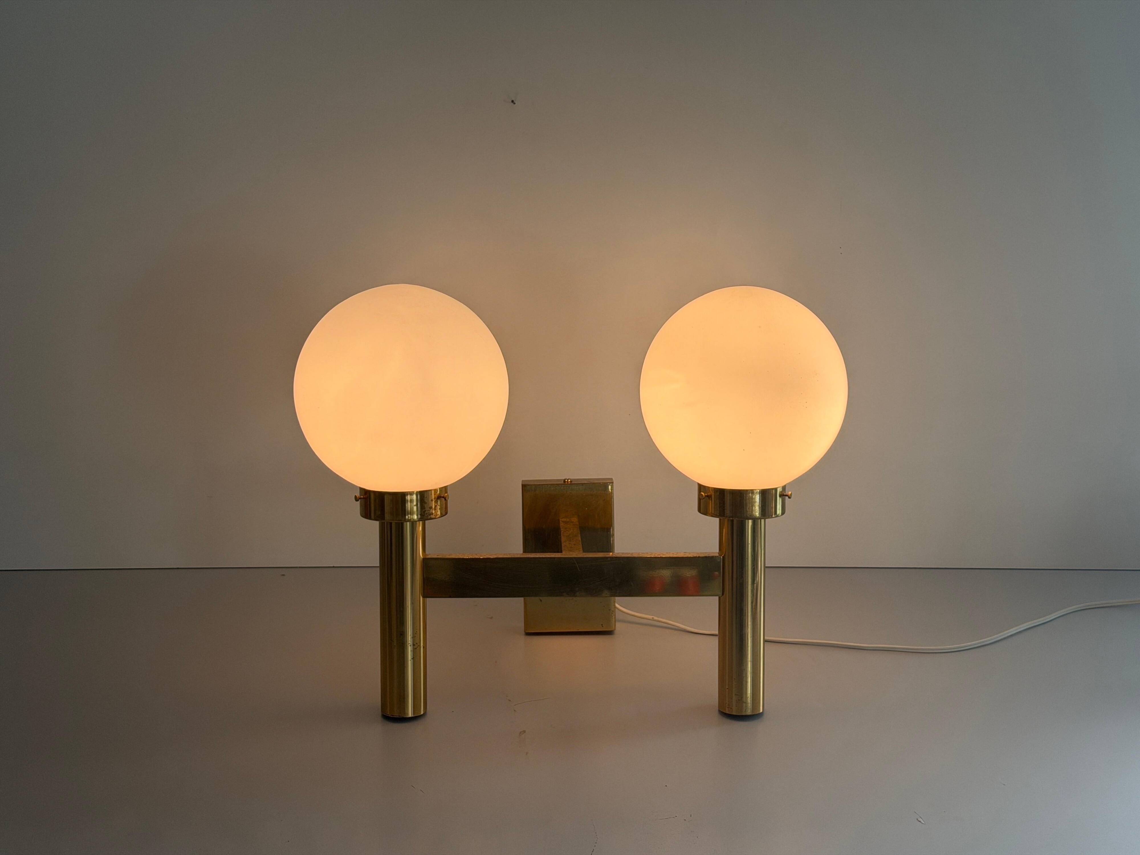 Double opal glass and heavy brass, large minimalist cinema wall light, 1960s, Germany