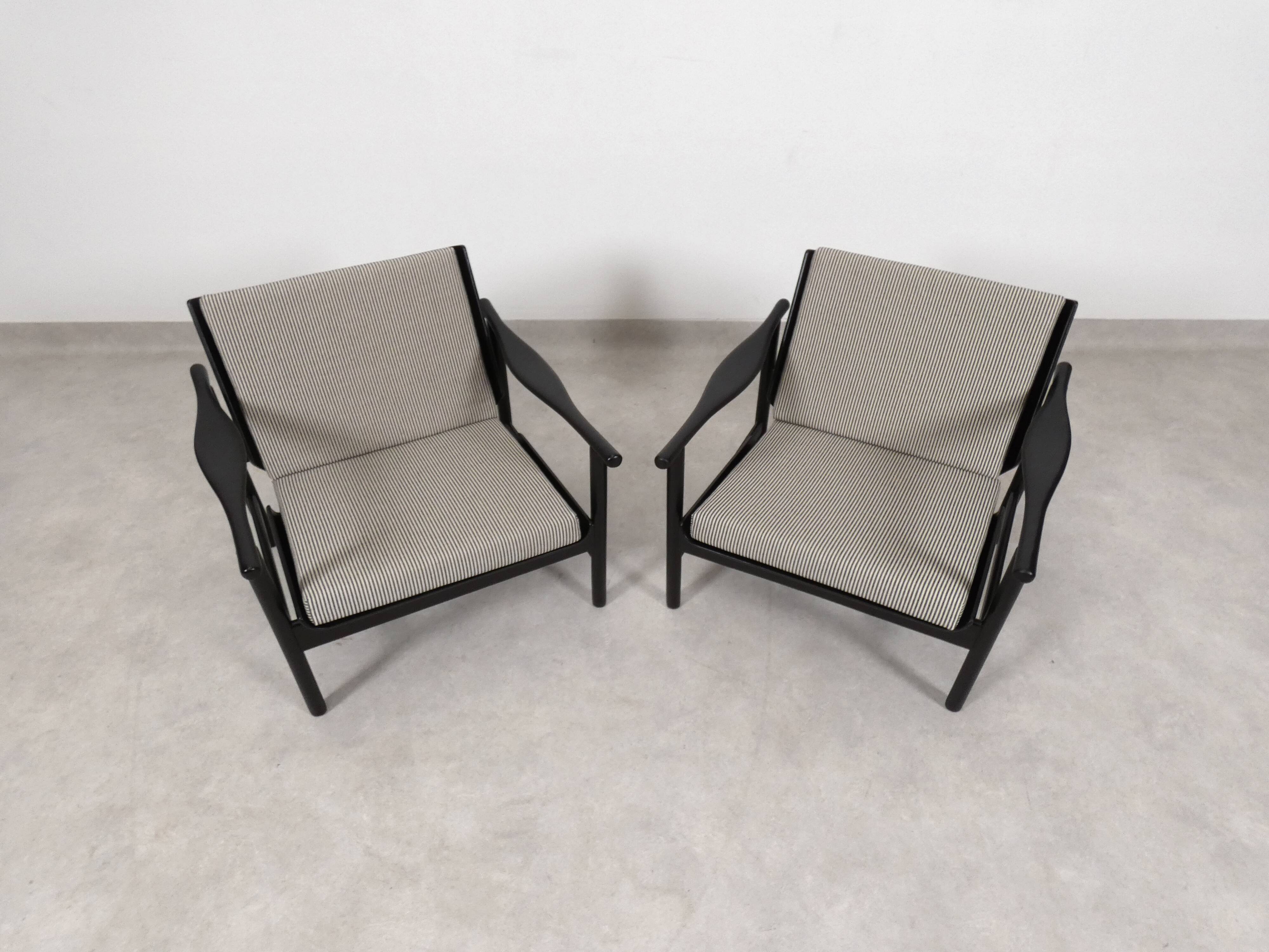 2x wooden Scandinavian arm chairs