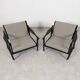 2x wooden Scandinavian arm chairs