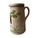 A pitcher in earthenware with a country décor