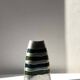 Vintage brushed aluminium vase with green stripes.
