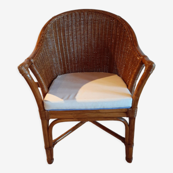 Armchair in adult varnished woven rattan