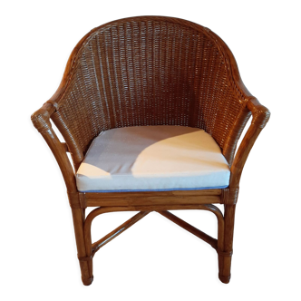 Armchair in adult varnished woven rattan