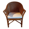 Armchair in adult varnished woven rattan