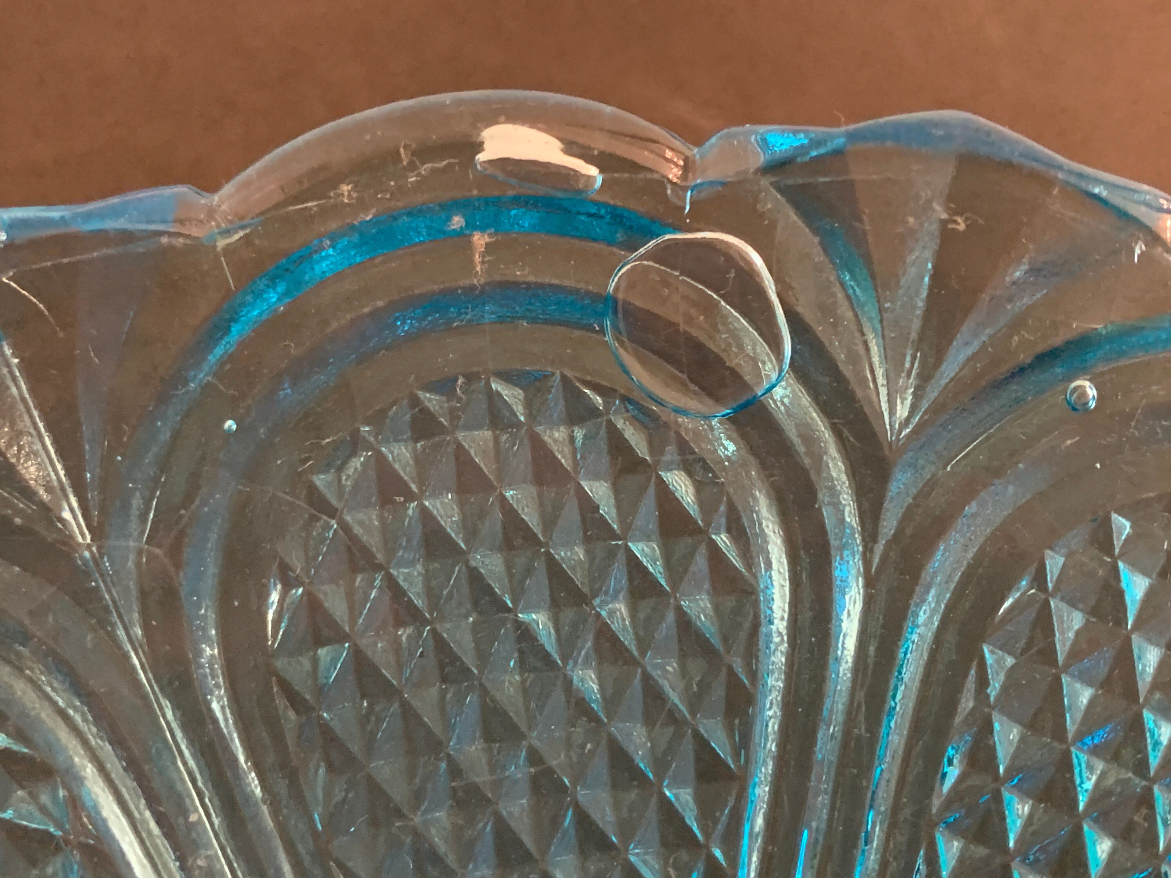 Fruit cup on blue-bubbled glass peder