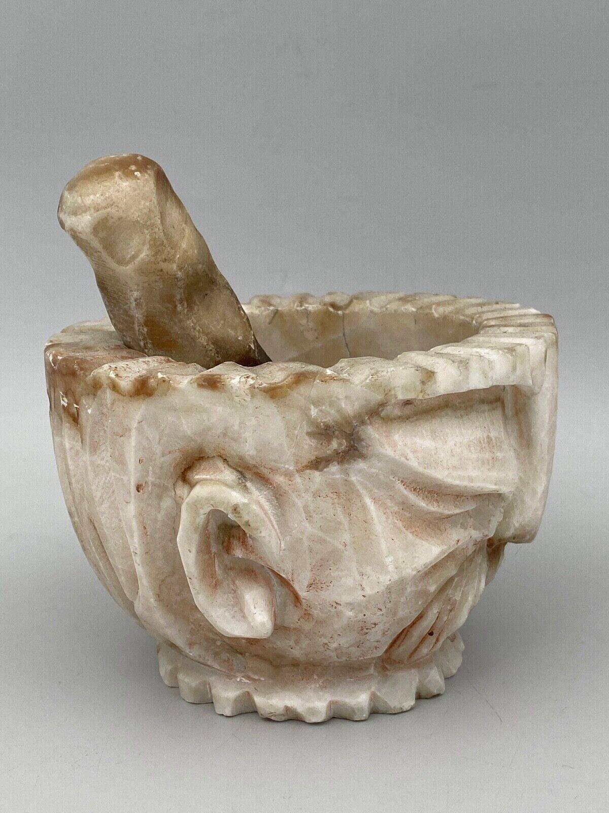 Pharmacy mortar and pestle in alabaster China man's face