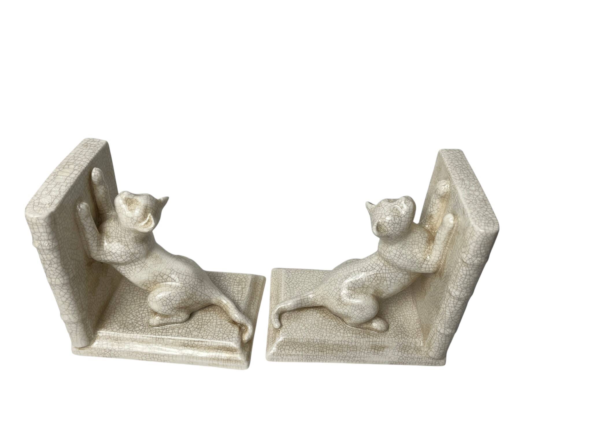 Art Deco, pair of crackled earthenware bookends featuring cats from Louvière around 1930.