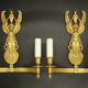 Large pair of wall sconces with winged caryatids in Empire style - gilded bronze