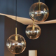 Set of three suspensions in glass and brass Limburg 70s