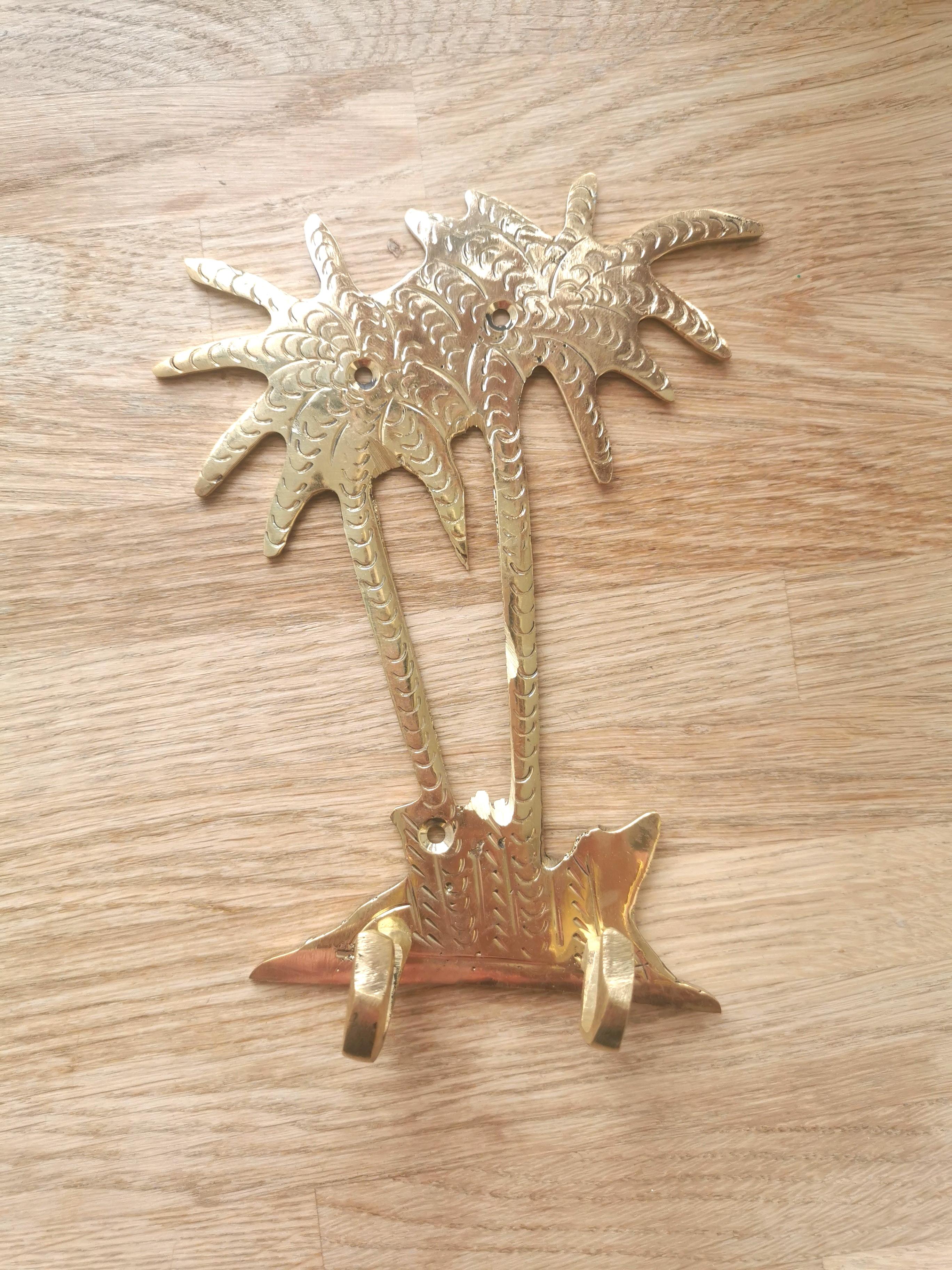 Golden brass palm wall hook