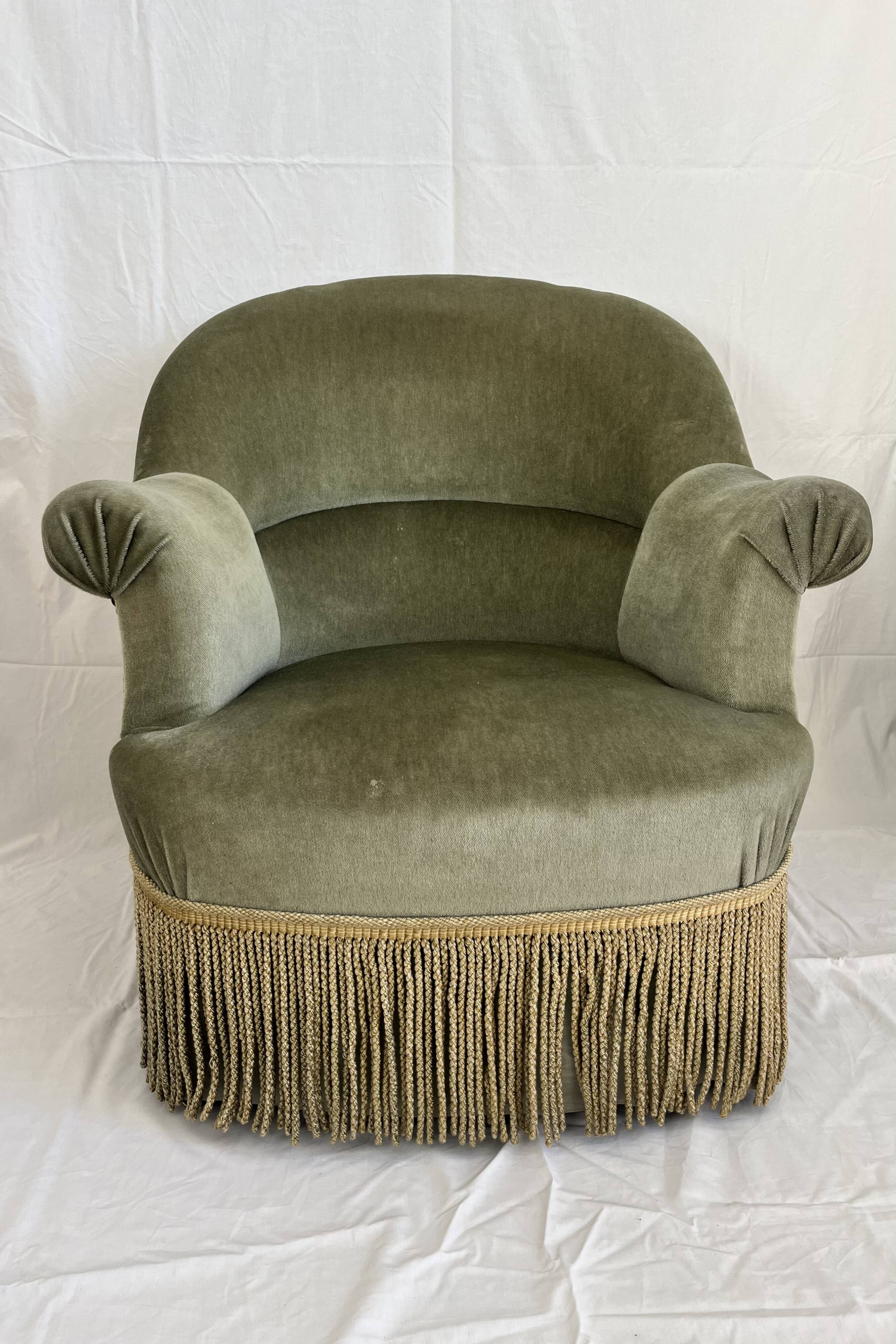 sage green toad armchairs with gold fringe