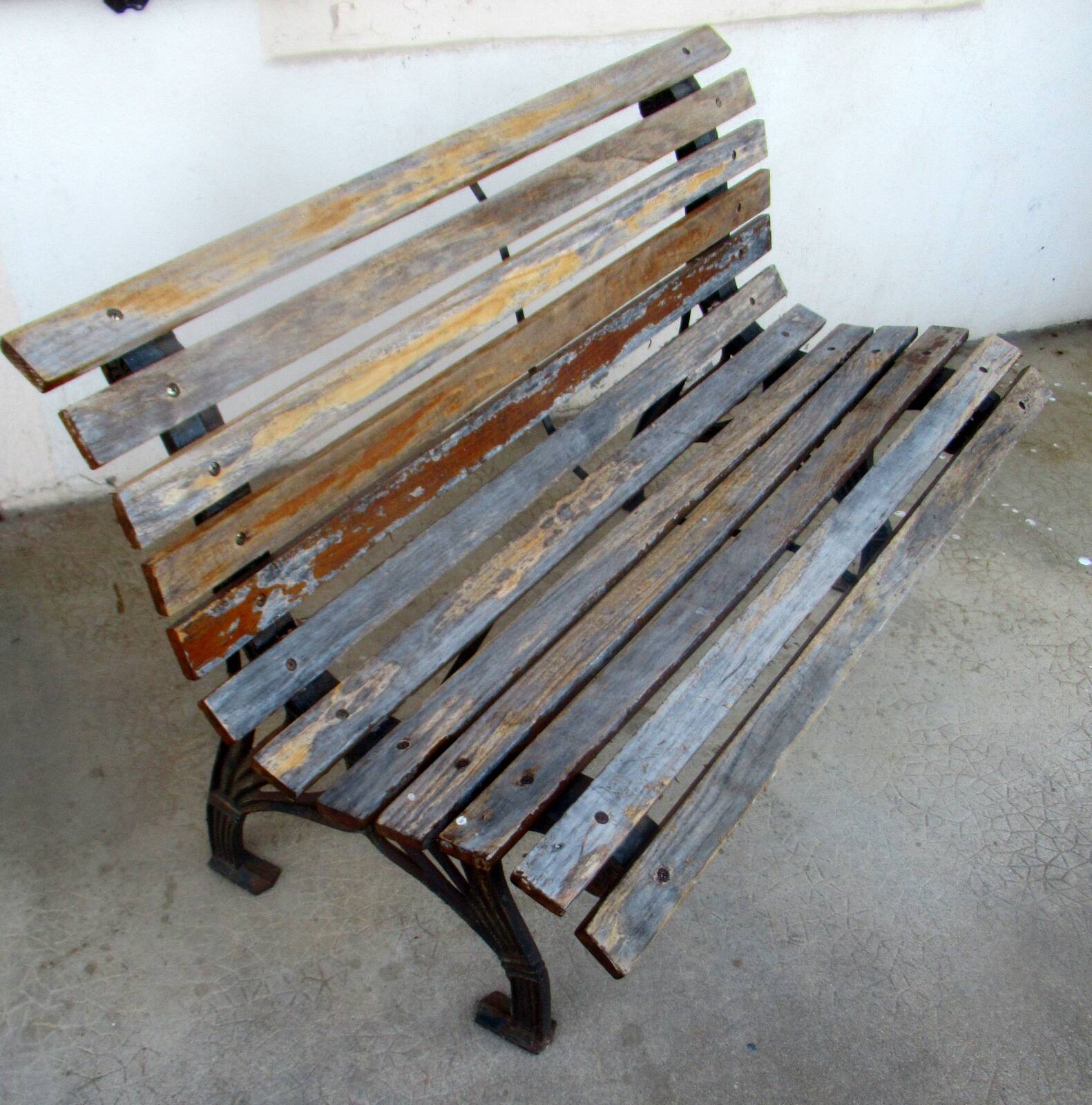 Small garden bench, with cast iron legs.