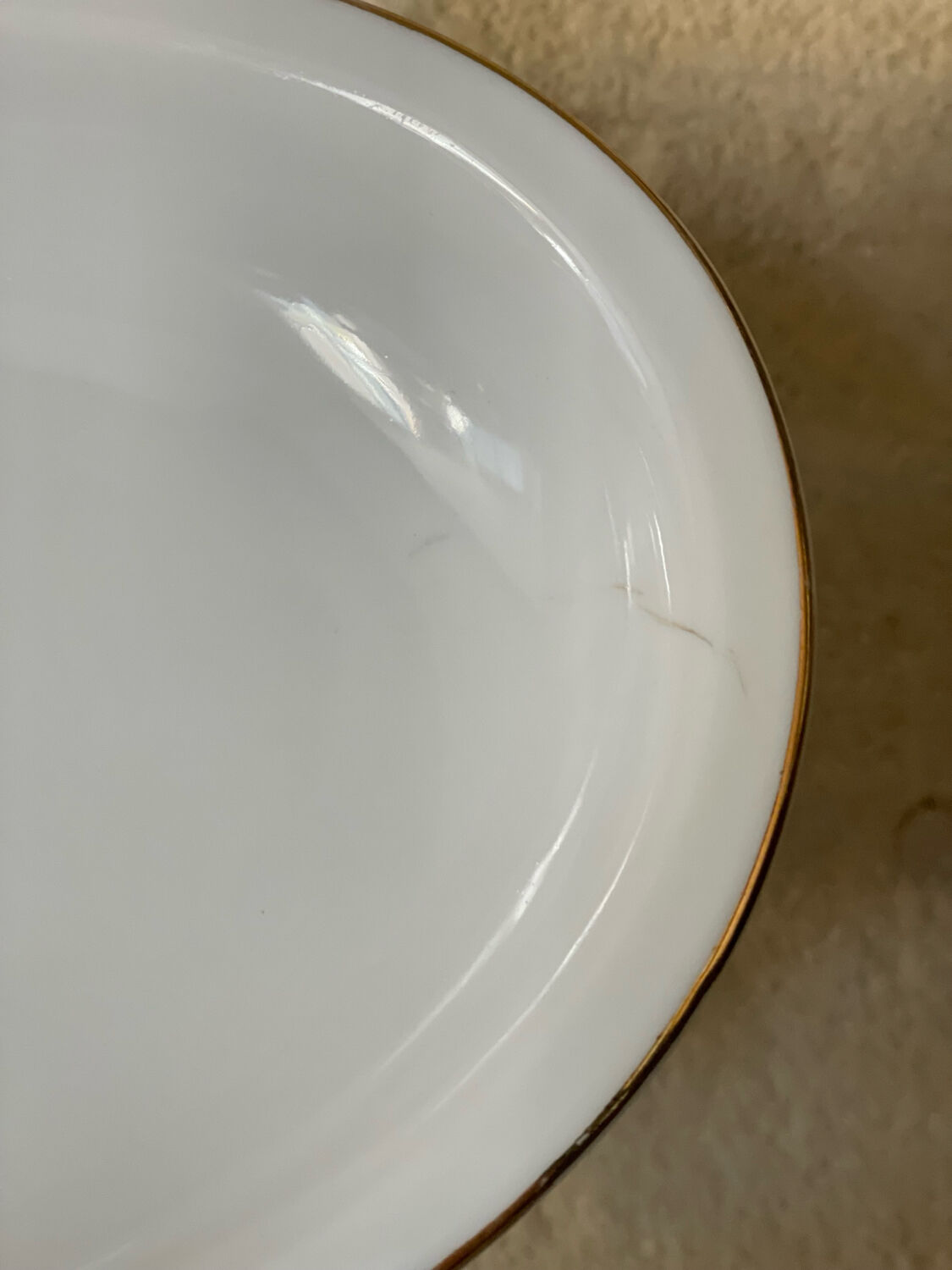 2 oval porcelain dishes with a floral pattern