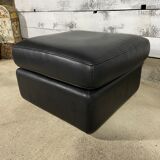 Black leather pouf
