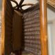 Wicker and brown wood magazine rack