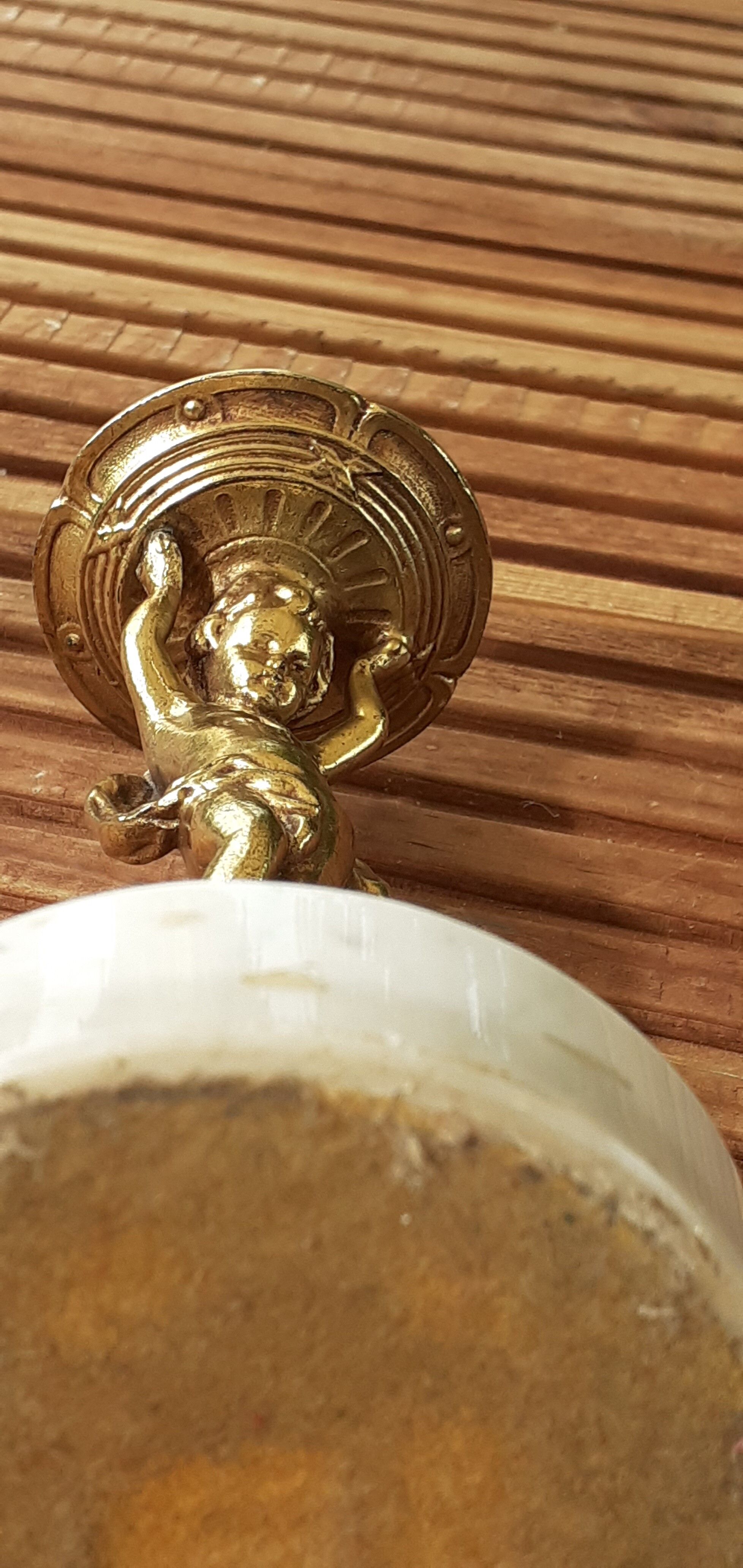 cherubic bronze lamp foot on marble base