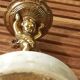 cherubic bronze lamp foot on marble base