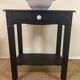 Small Art Deco console reinterpreted – matte black wood with drawer