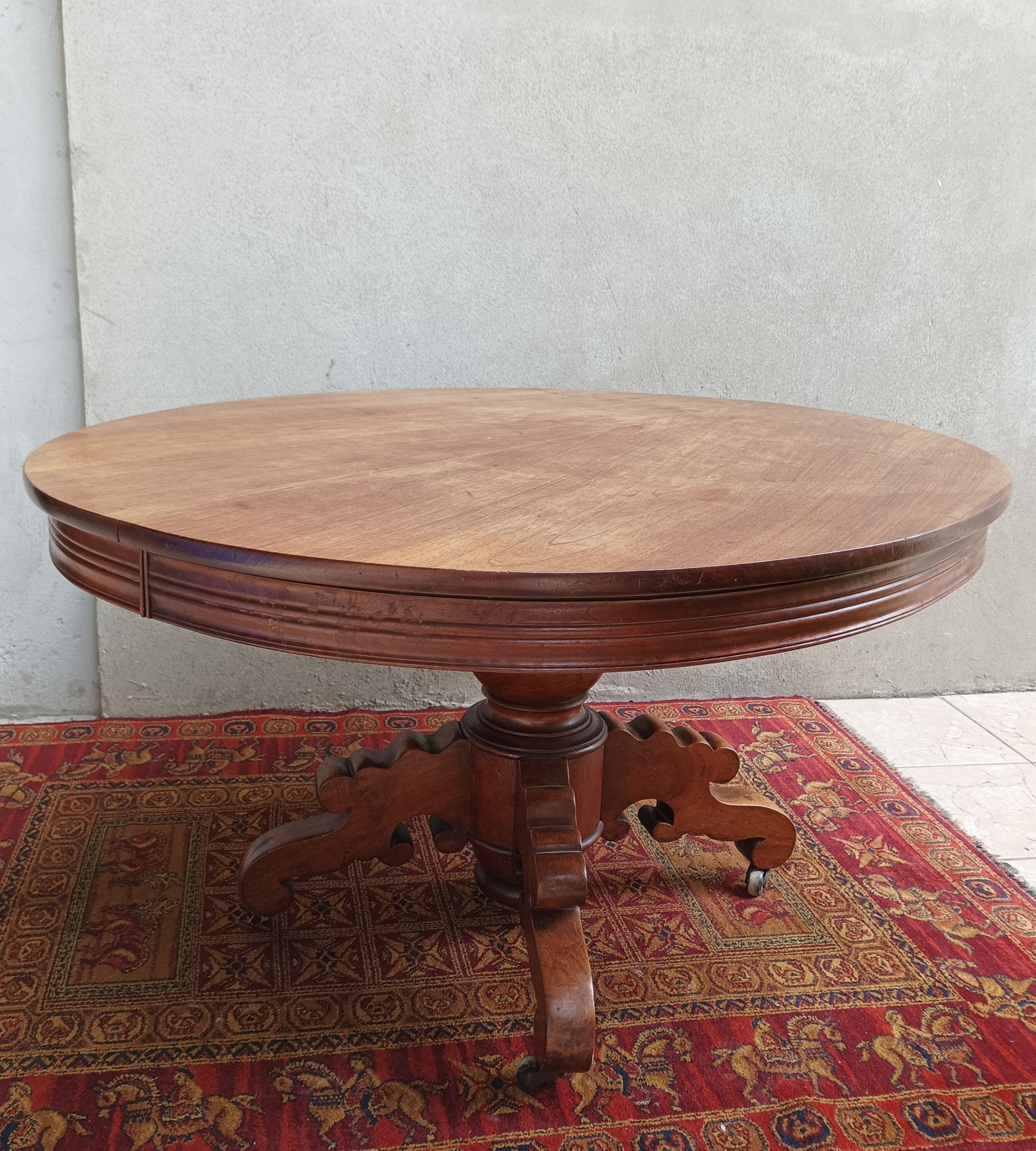 English oval table with 19th century mahogany extensions