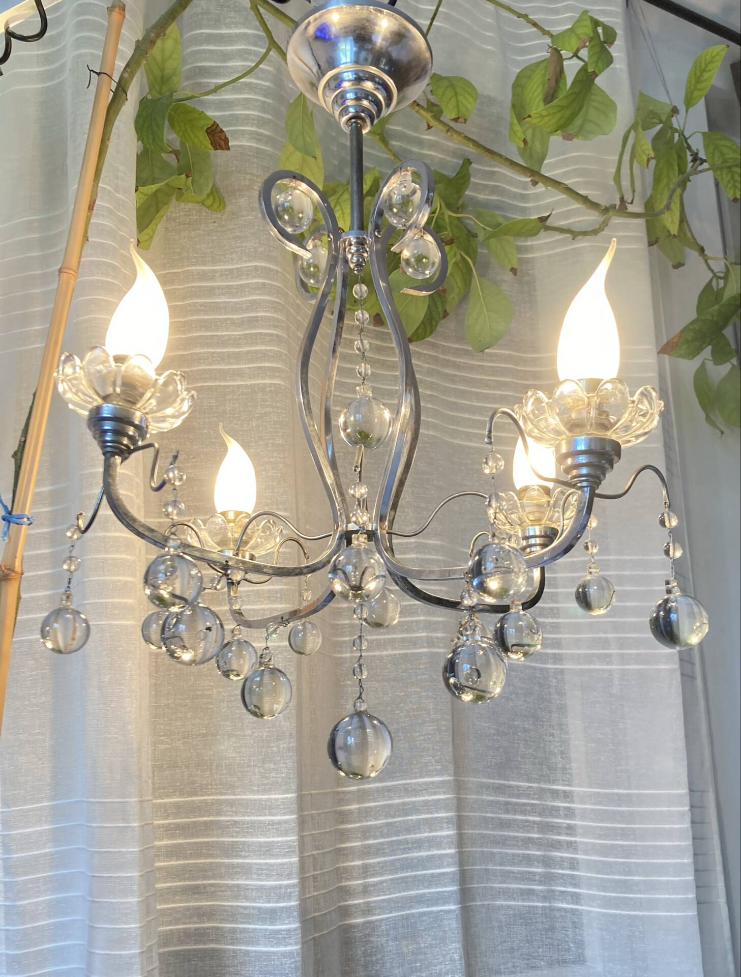 Art Deco chandelier from the early 20th century in chrome brass, with glass pendants.