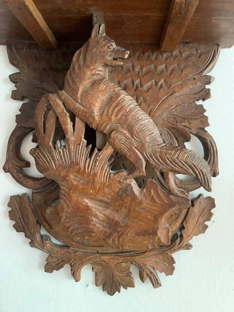 Black Forest carved wooden wall console, harness with wolf decoration