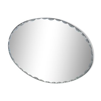 Old beveled oval mirror to pose