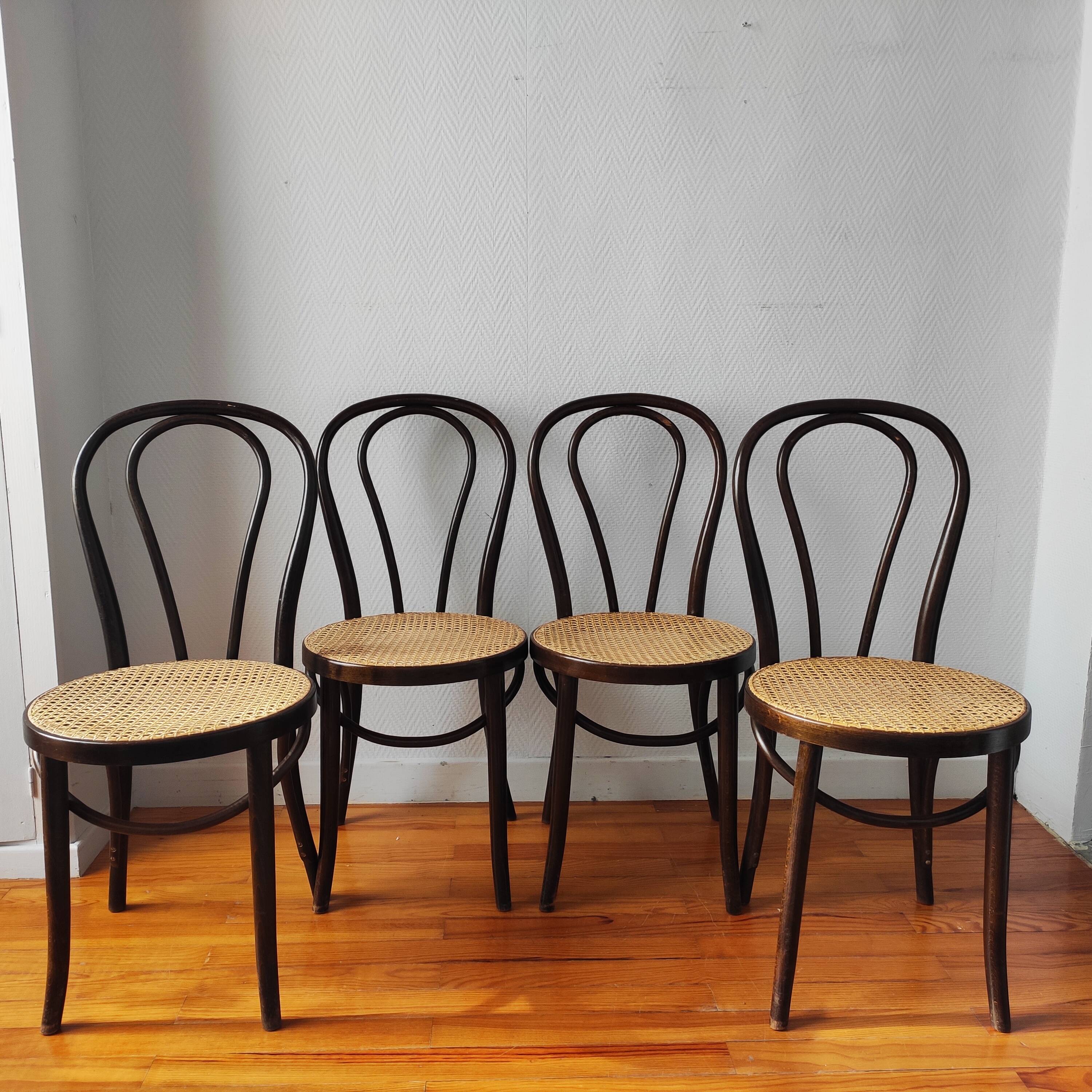 4 antique curved wood and cane chairs