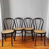 4 antique curved wood and cane chairs