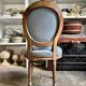 Medallion back chair in reclaimed wood and blue cotton, 18th century.
