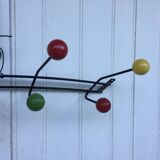 Roger Feraud wall-mounted wooden coat rack with colored balls, 1950