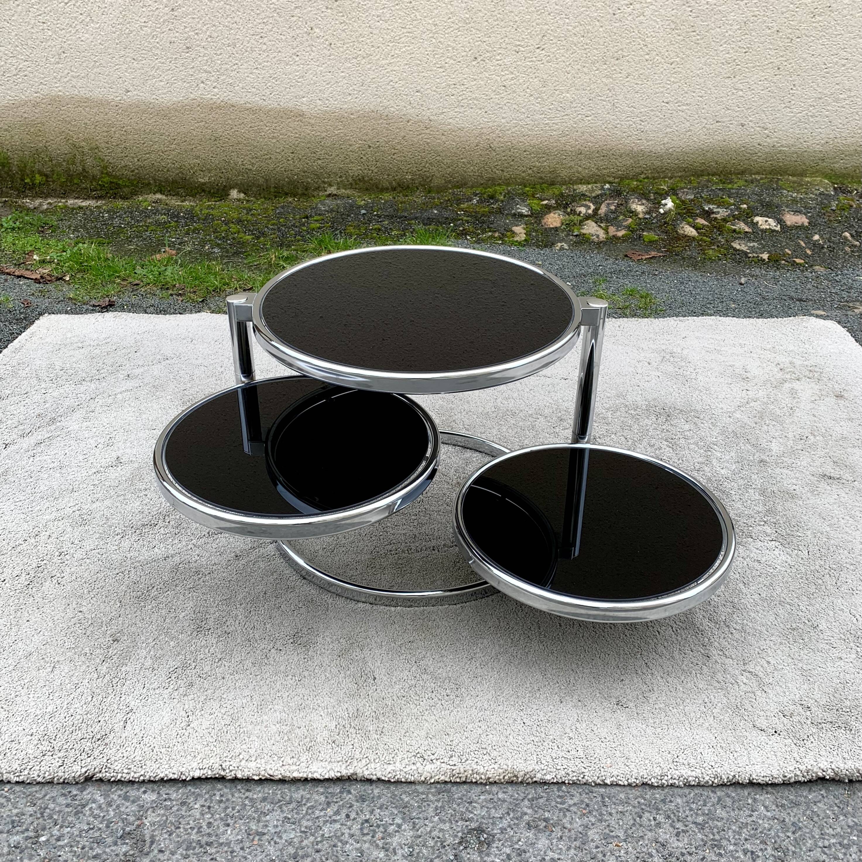 Articulated coffee table with 3 shelves, black glass and chrome, 1980
