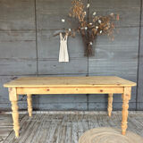 Old farmhouse table in raw wood