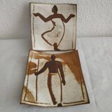 Two terracotta bowls with ethnic decoration and vintage signature.