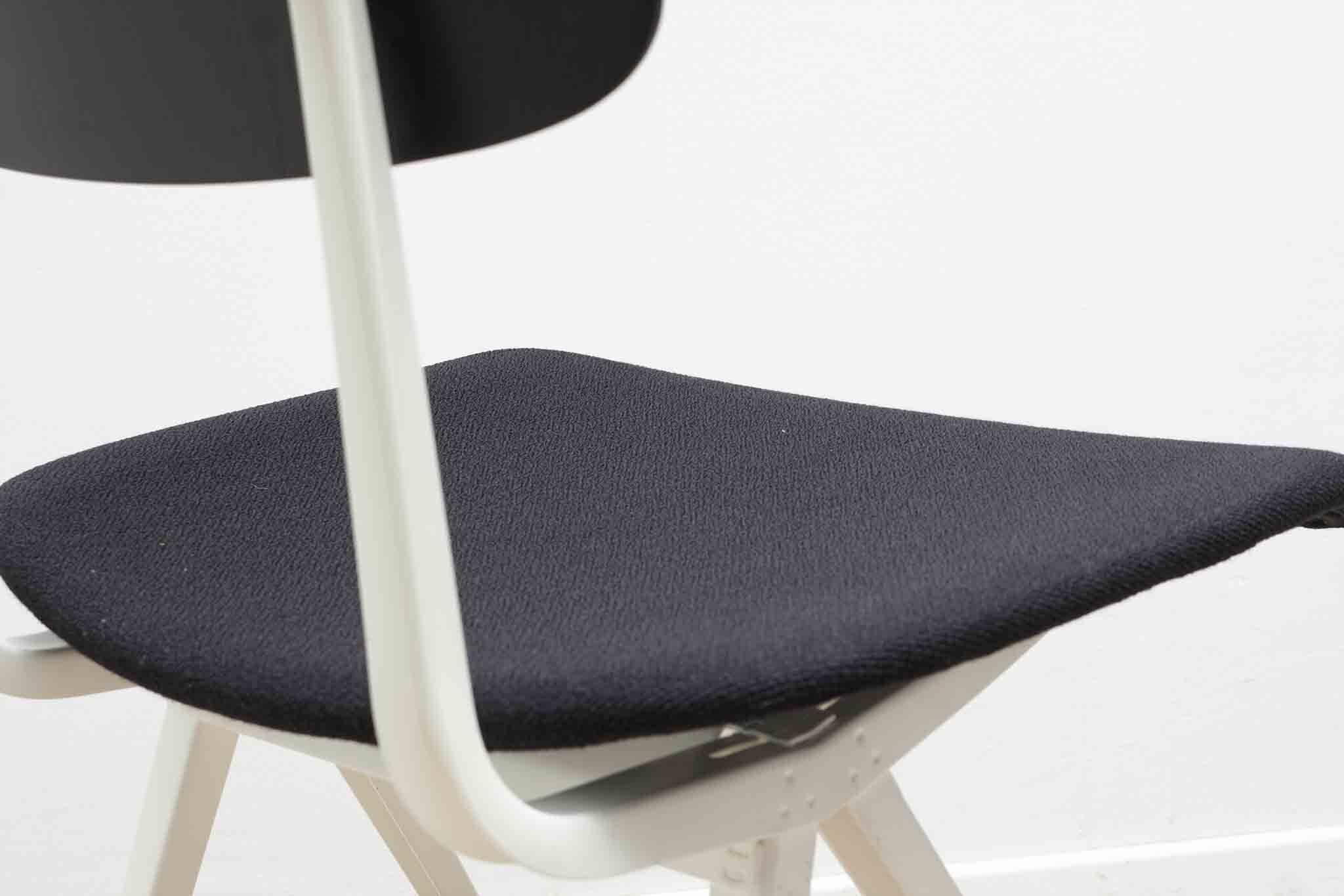 Friso Kramer "Result" chair upholstered in black and white.