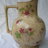 Antique pitcher decorated with flowers