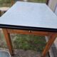 Vintage Scandinavian table and chair set with a wooden frame and formica top.