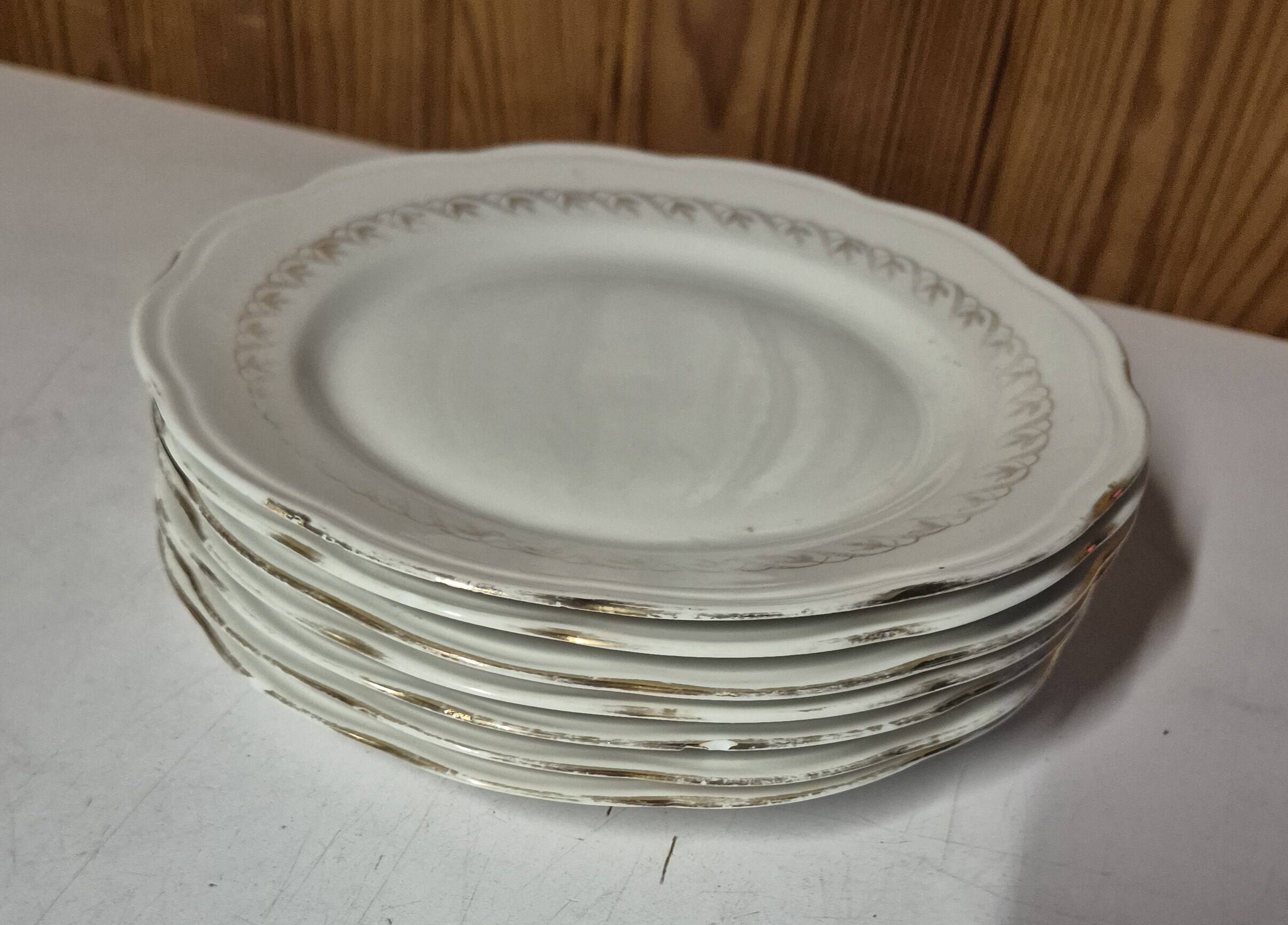 Set of 7 fine porcelain dessert plates with gilding, SFP, French company