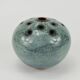 Vase with blue flowers.