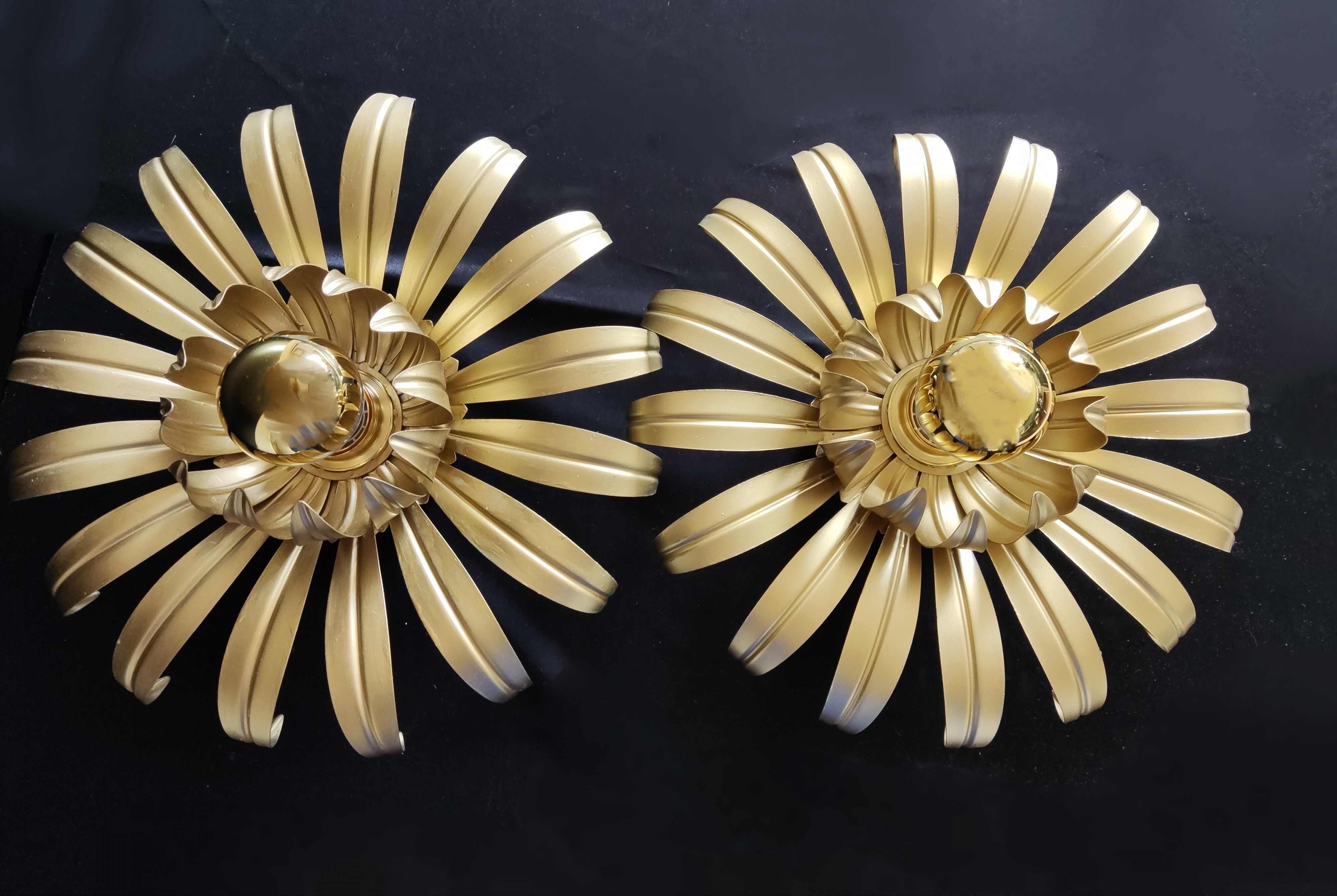 Golden metal flower sconces