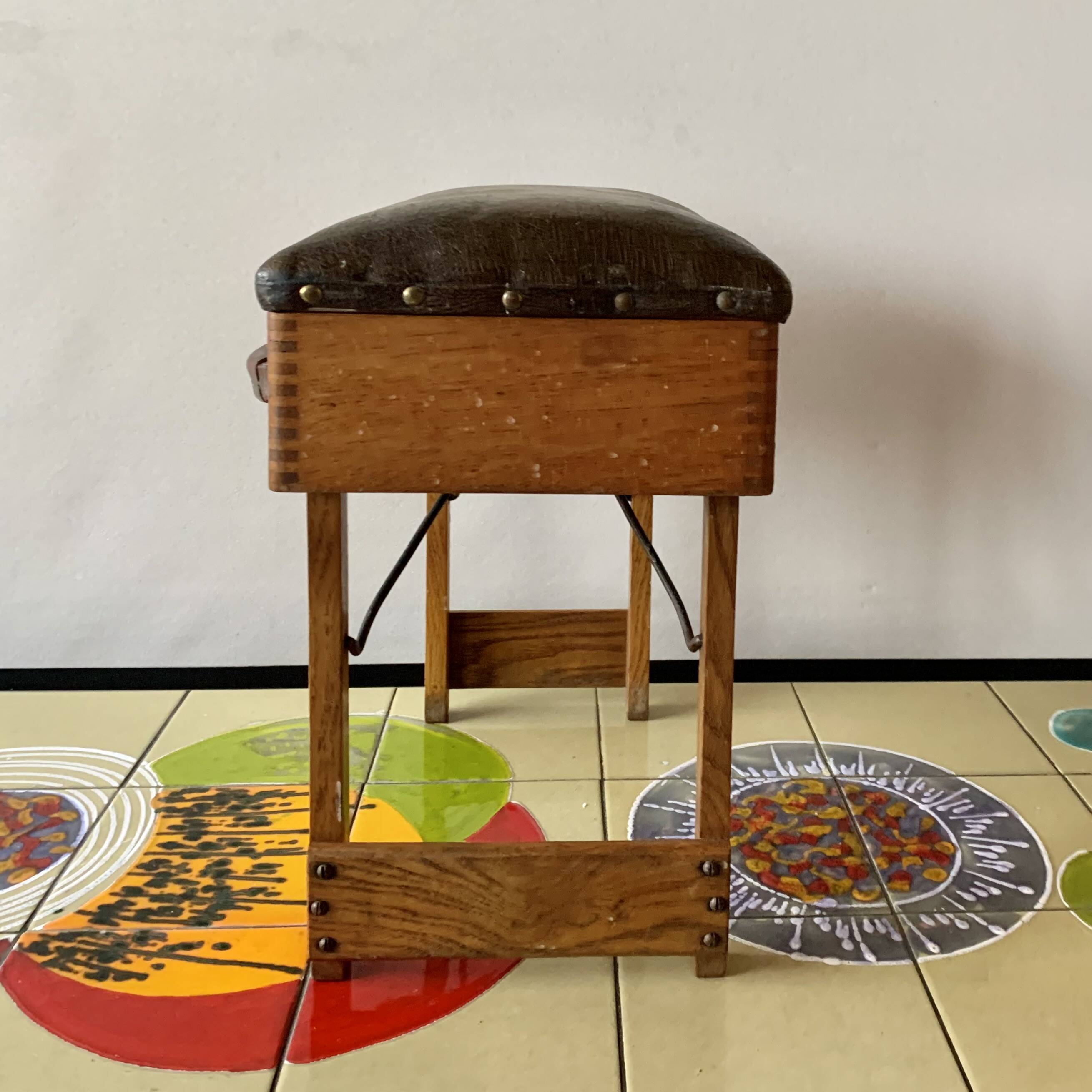 Old foldable fisherman's stool in wood and leather