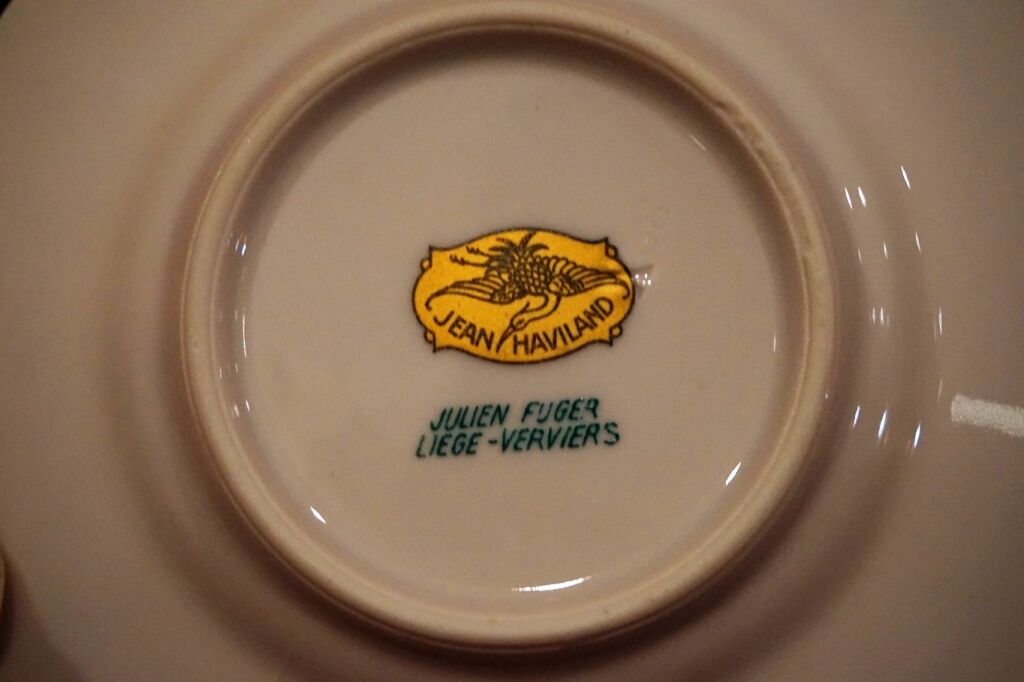 Old saucer cup in pink porcelain of Limoges
