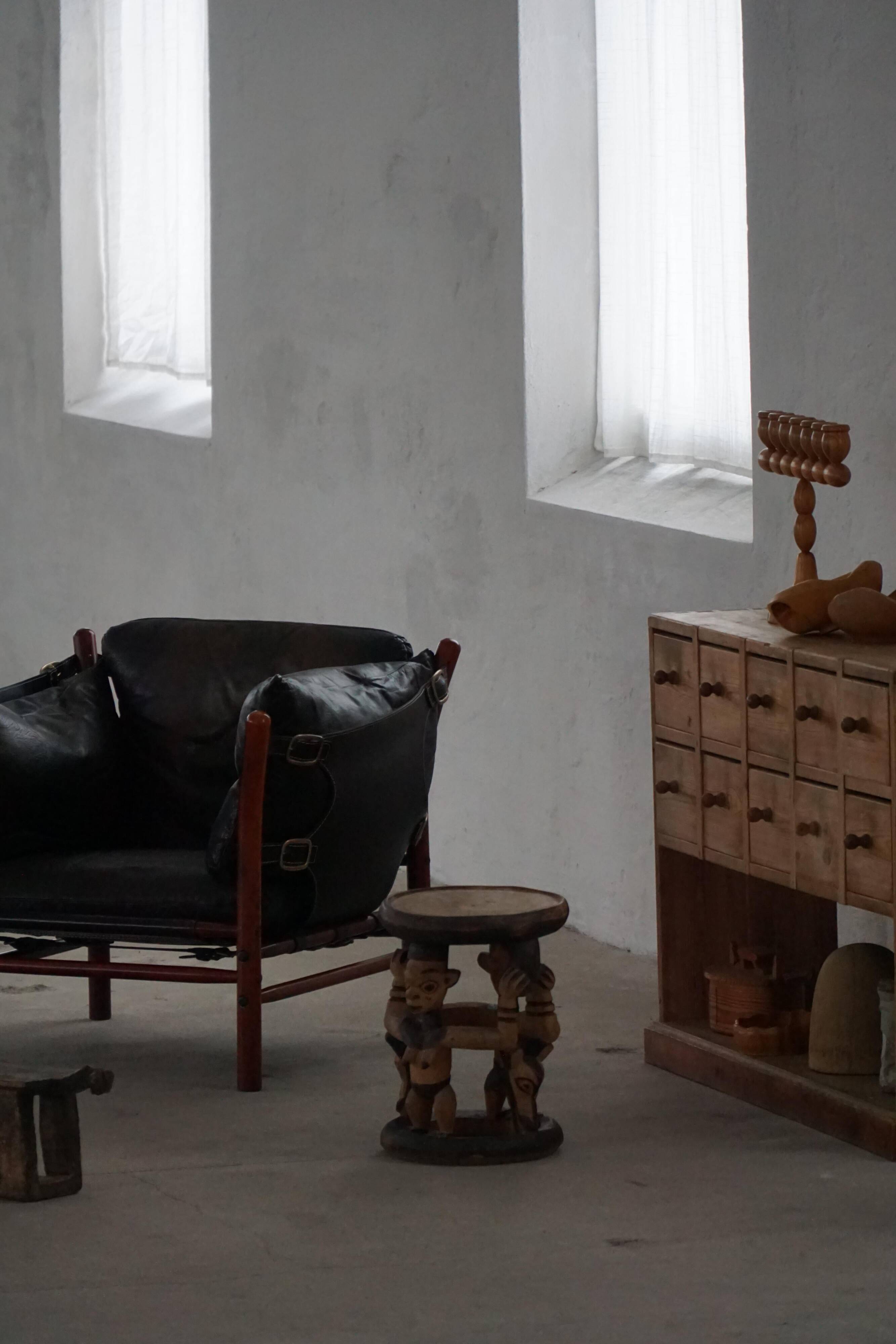 "Lounge chair 'Ilona' by Arne Norell in stained beech and leather, mid-20th century."